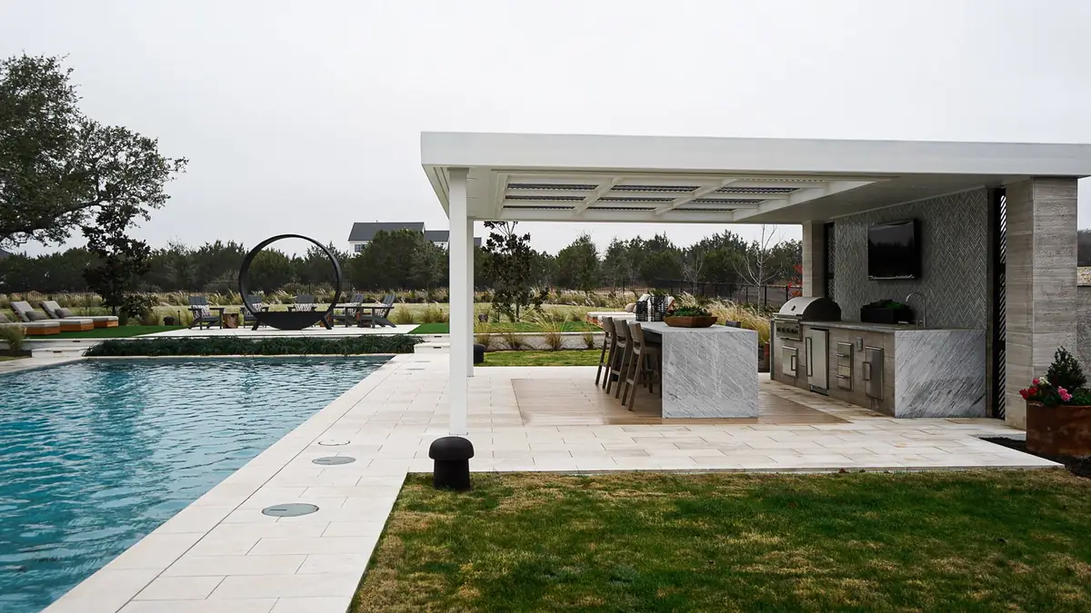 White steel pavilion over a poolside outdoor kitchen, built by TG Welding