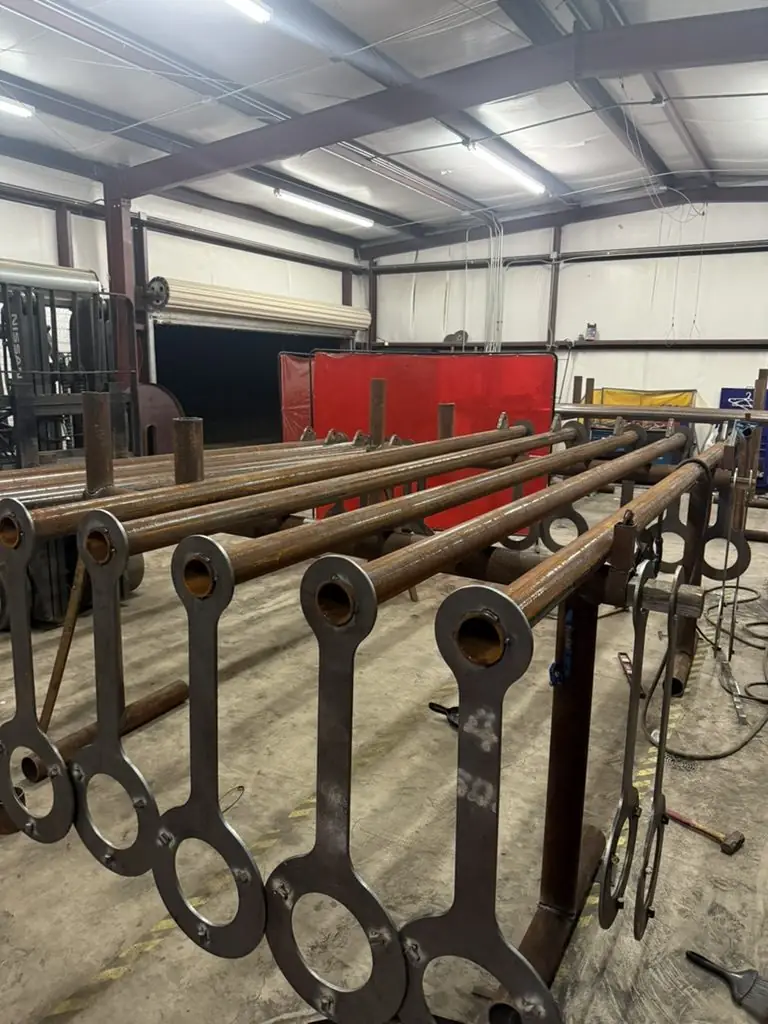 Pipe rails with lifting lugs racked in the bay