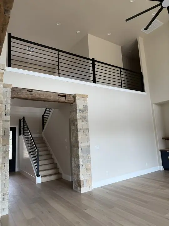 Black horizontal bar loft rail and matching stair rail