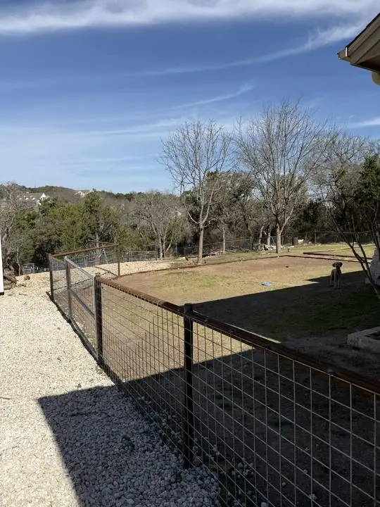 Pipe frame and wire panel yard fence