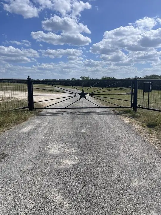 Ranch entrance gate with cut steel Texas star