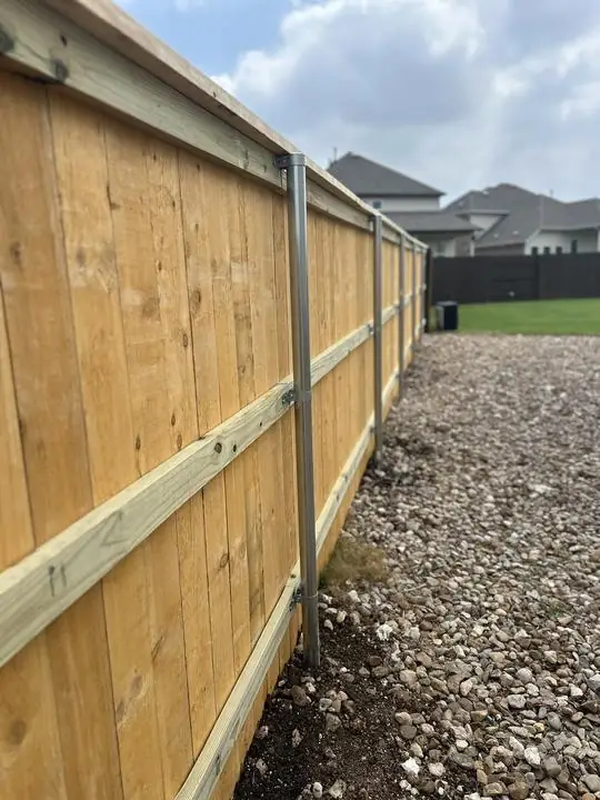 Cedar privacy fence built on steel posts