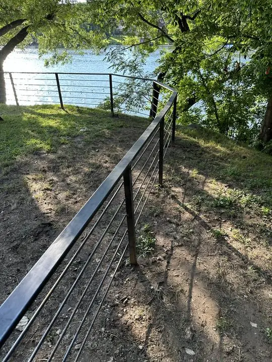 Steel rod rail fence along the waterfront