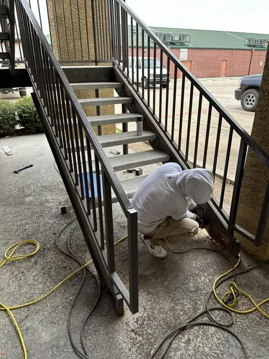 Fitting the base of a steel stair railing