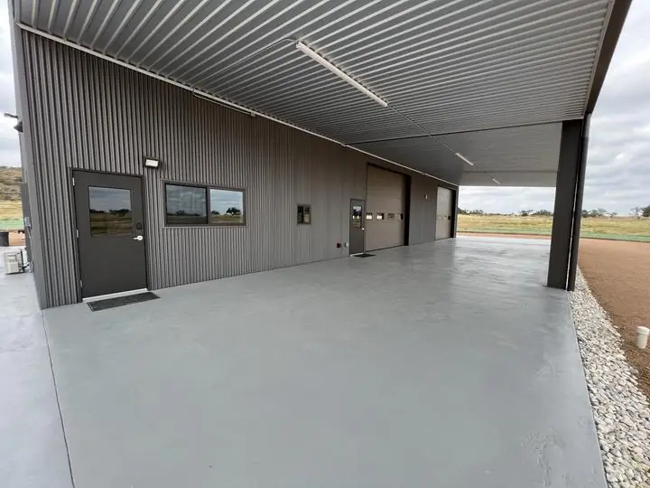 Covered porch running the length of the shop