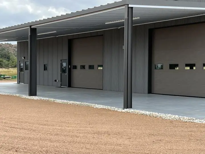 Covered bays with overhead doors and steel columns