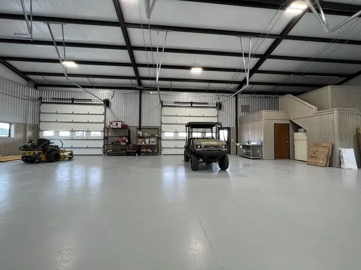 Finished shop interior with epoxy floor and loft