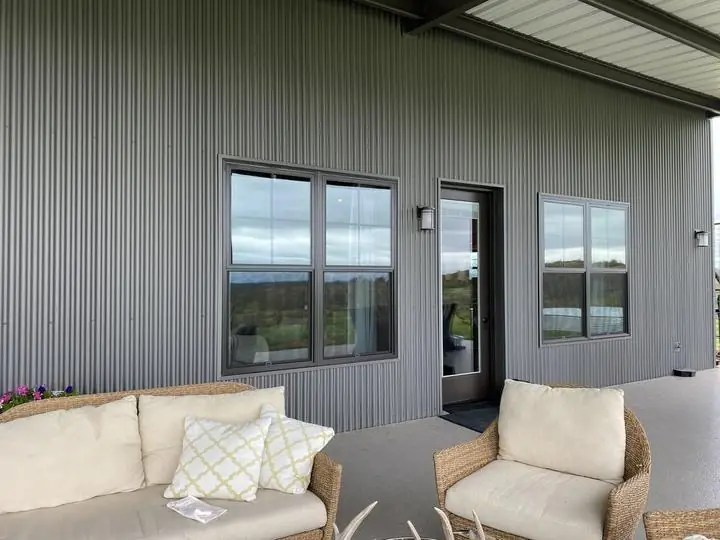 Covered patio outside a steel home